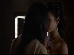 Indira Varma completely nude as she lays on a bed and we