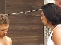 A slim blonde beauty from Germany gets pounded by two hard cocks outdoors