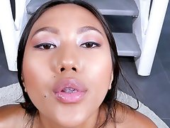 Charming Asian pornstar May Thai drops on her knees to give him a BJ
