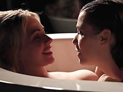 Alluring lesbians share the soapy tub for intimate moments